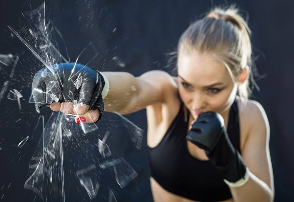 woman breaking glass